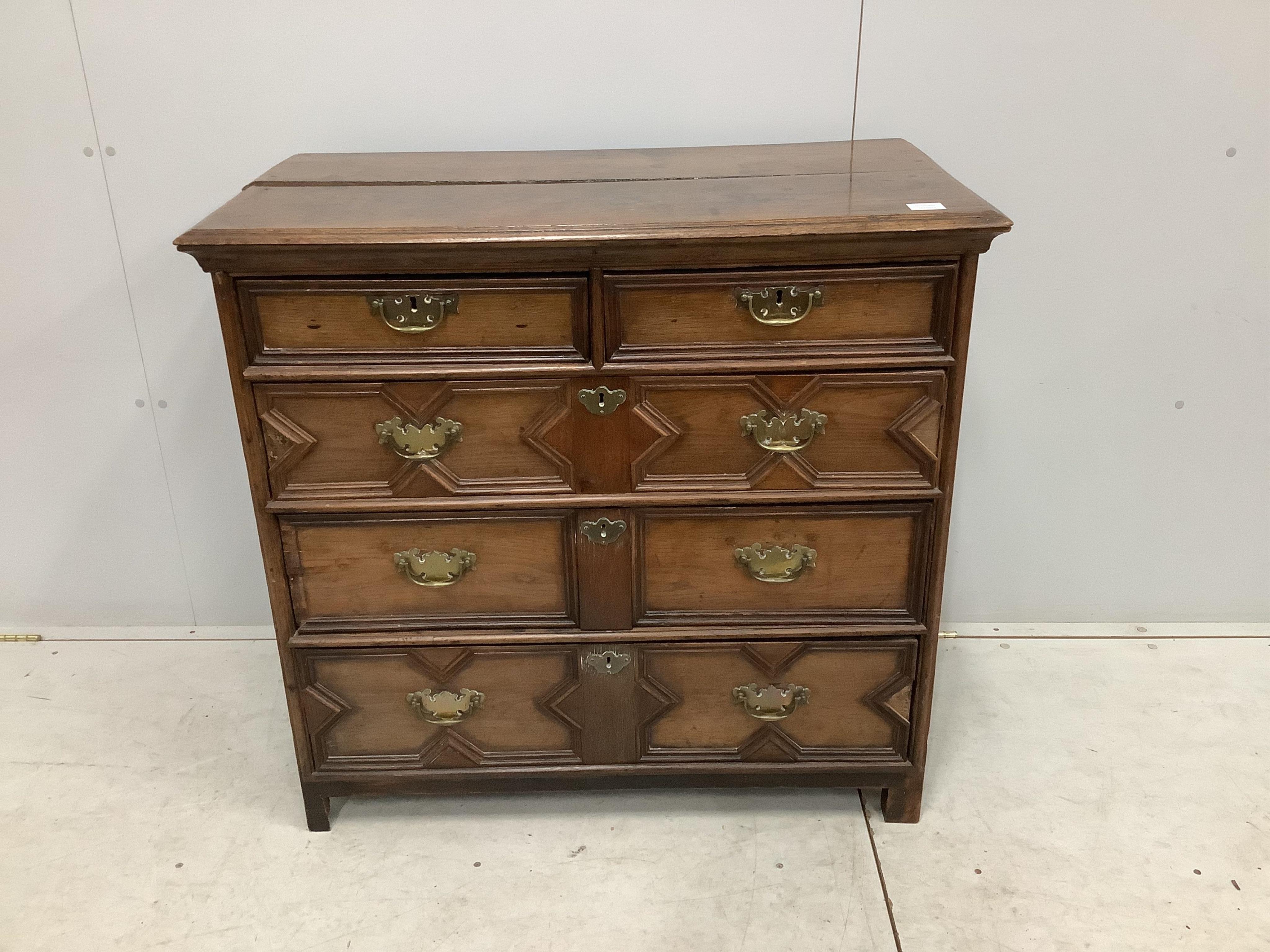 A Carolean geometric moulded oak chest of drawers, width 97cm, depth 51cm, height 91cm. Condition - poor